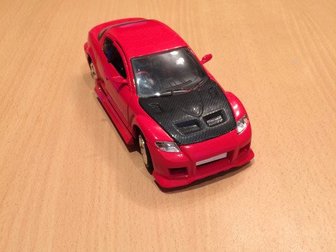 Машинка модельная  Mazda RX-8 размером 1:24,  Имеет открывающиеся двери , капот ,   В комплекте также имеются сменные колеса, капот , кресла , инструмент для сборки, в Чебоксарах